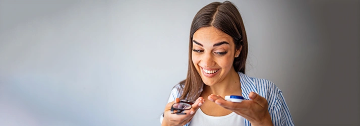 Woman Holding Contact Lenses